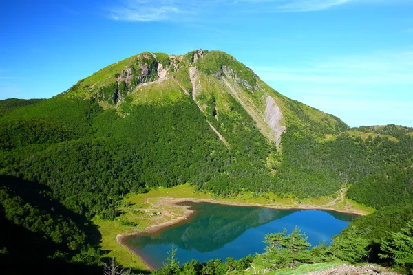 Mountain and blue pond — Stock Photo, Image
