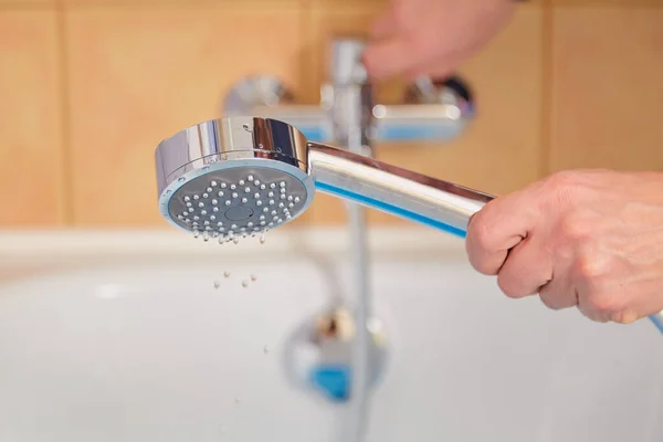 Hand Holds Shiny Shower Head Bathtub Close — Stock Fotó