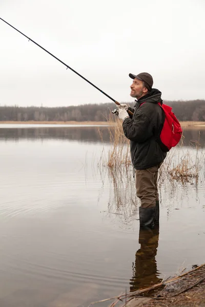 Spinning Player Rubber Boots Stands Water Catches Predatory Fish Red — Stock Photo, Image