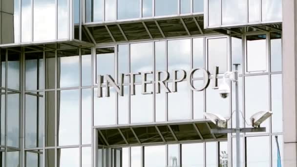 Interpol logo on building — Stock Video