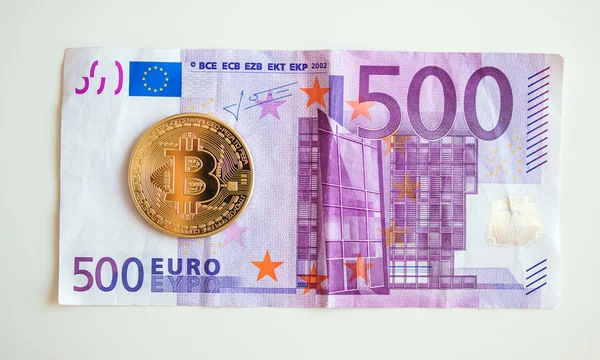 Bitcoin over five hudred euro bill — Stock Photo, Image