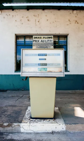 Old gas station in France with text essence sans plomb — Stock Photo, Image