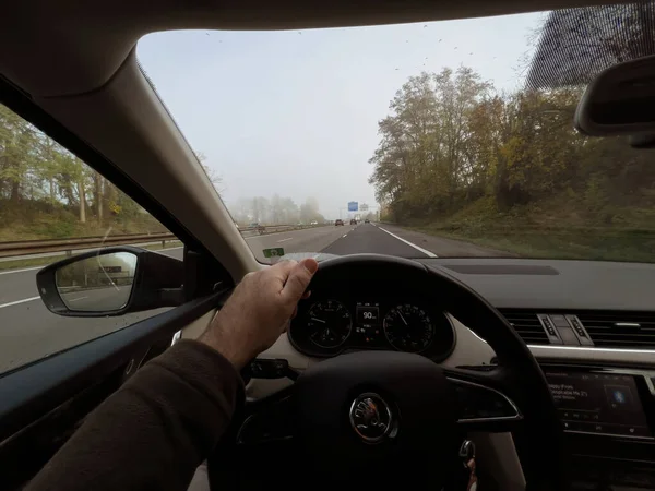 Driver POV at the fluid highway driving with cars and trucks seen from the Skoda electric vehicle — стоковое фото