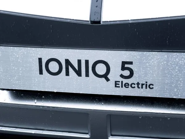 Front view of new Ioniq 5 Electric car by hyundai inscription on the registration number — стоковое фото