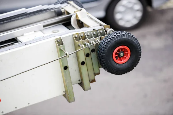 Close-up macro shot of rubber wheel of an electronic ladder — Stock Photo, Image