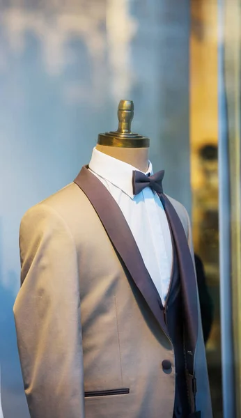 Male suit tuxedo defocused background on mannequin in the living room