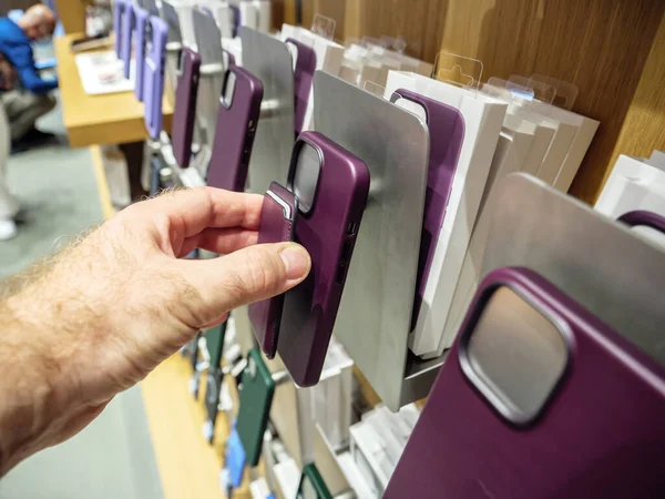 POV male hand holding iPhone Leather Wallet with MagSafe above case — Stockfoto