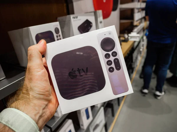 POV male hand holding buying new package with Apple TV 4k and new Siri Remote — Foto Stock
