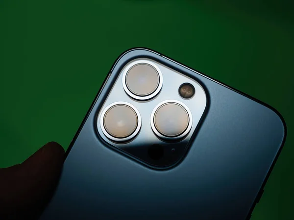Apple Computers iPhone 13 pro smartphone showing the triple camera on the rear — стокове фото