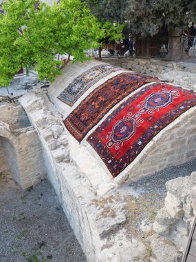 Traditional Azeri carpets for sale at vintage flea market presen