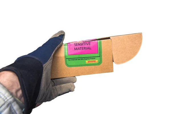 DHL open cardboard damaged box with inscription Sensitive material - For internal use DHL express France —  Fotos de Stock