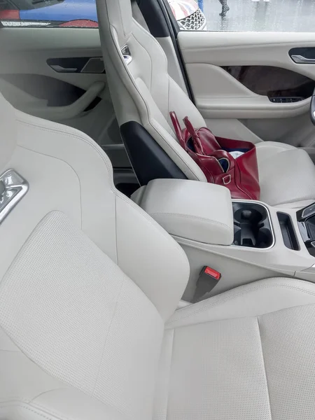 Luxury leather bag case left on the driver seat in luxury interio — Photo