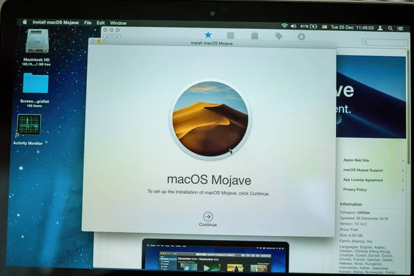 MacOS MOjave seen on the display of on the Apple Computers MacBook Pro laptop prior upgrade — Stock Photo, Image