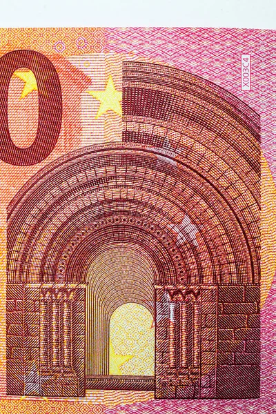 Close-up macro detail part of 10 euros ten banknotes depicting bridges and arches doorways in Romanesque architecture — Stock Photo, Image
