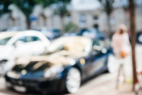 Defocused view blur unrecognizable modern sport luxury expensive car — Stock Photo, Image