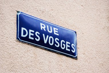 Rue des Vosges blue inscription street name on the wall of a building in central Strasbourg