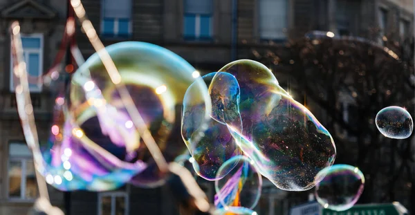 Multiple Balloon Bubble Made Soap Flying City Apartment Building Background — Stock fotografie