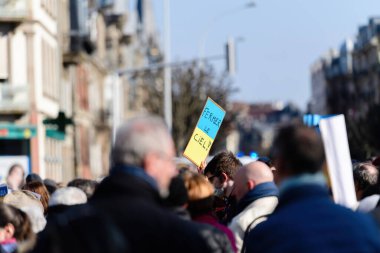 Strasbourg, France - Mar 6, 2022: Close the sky in french placard as Hundreds of demonstrators gathered in front of Russian Consulate in solidarity with Ukrainians and against the war after Russian