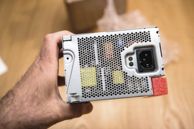 POV male hand holding object replacement part computer power supply unit