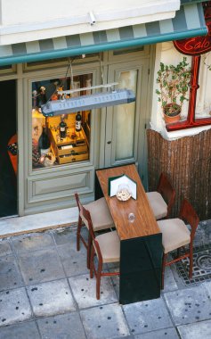 View from above of a wine bar with four stools and raised table - waiting for customers