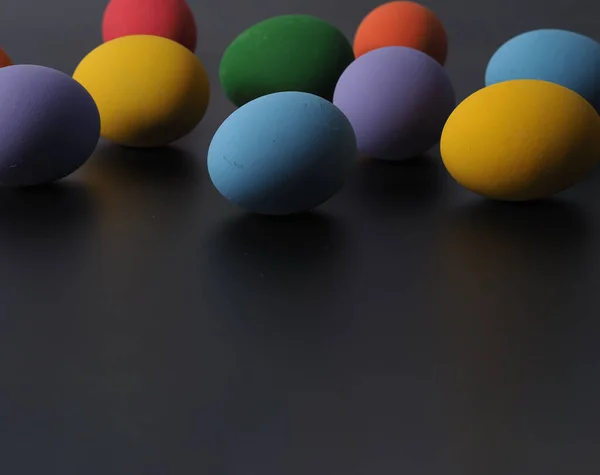 Easter eggs or color egg. Multi-colorful of easter eggs on background in studio with close-up shot which include many colour such as yellow, green, blue, purple, red on festival eggs by art painting.