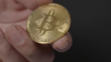 Gold Bitcoin giving and receiving by hand. Represent cryptocurrency transaction of buying and paying with digital money asset. Digital wallet business financial concept. Crypto blockchain technology.