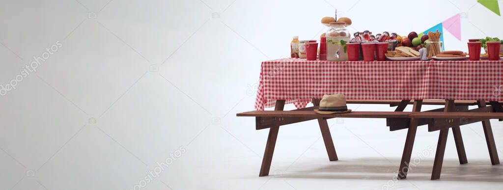 Picnic table and red checkered tablecloth with food and drink for outdoor party. Isolated white background. Wooden party table with foods and BBQ grills stove for summer picnics activities. Isolate.