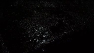 Night Rain. Raining on the floor. 4K Footage Rain Drops Fall on the floor and balcony at night in Bangkok Thailand in raining season. Rain is speedy at night. Shower rainfall. Rain falling Footages.