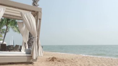 Beach Sand and Sea. Pattaya beach which one of the famous sea locations in Thailand. Represent vacation relaxing. Open country for travelers after Covid 19 pandemic. Sea waves and sand with blue sky.