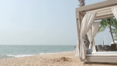 Beach Sand and Sea. Pattaya beach which one of the famous sea locations in Thailand. Represent vacation relaxing. Open country for travelers after Covid 19 pandemic. Sea waves and sand with blue sky.