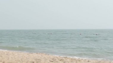 Beach Sand and Sea. Pattaya beach which one of the famous sea locations in Thailand. Represent vacation relaxing. Open country for travelers after Covid 19 pandemic. Sea waves and sand with blue sky.