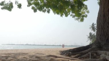 Beach Sand and Sea. Pattaya beach which one of the famous sea locations in Thailand. Represent vacation relaxing. Open country for travelers after Covid 19 pandemic. Sea waves and sand with blue sky.