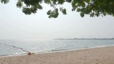 Beach Sand and Sea. Pattaya beach which one of the famous sea locations in Thailand. Represent vacation relaxing. Open country for travelers after Covid 19 pandemic. Sea waves and sand with blue sky.