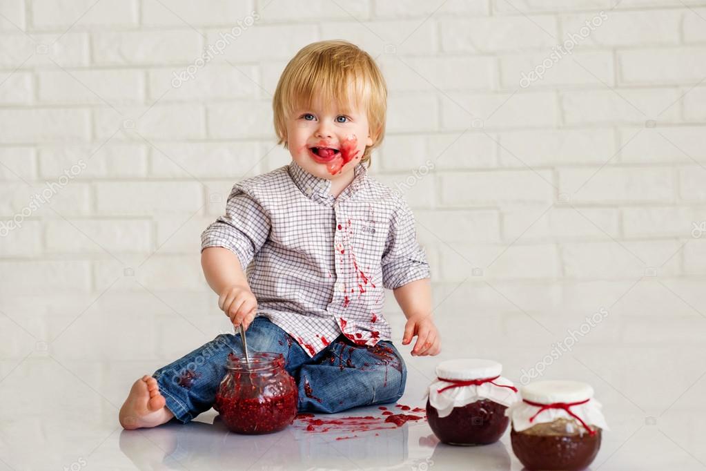 Kid eating strawberry jam ⬇ Stock Photo, Image by © zoiakostina 25616129
