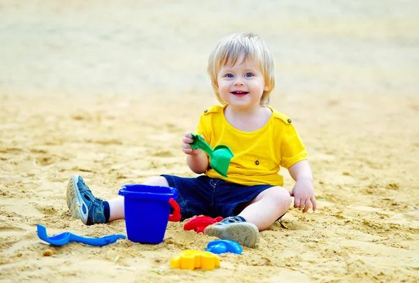 Cute kid in the sandpit — Stock Photo, Image