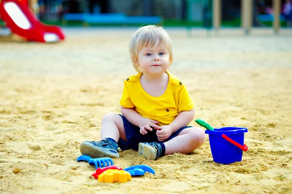 Toddler in the sandpit — Stock Photo, Image