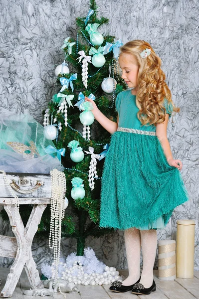 Beautiful blonde girl and Christmas tree — Stock Photo, Image