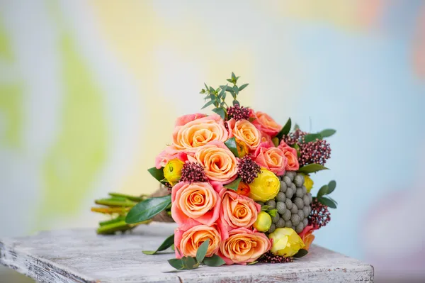 Wedding bouquet with beautiful orange roses and yellow ranunculus — Stock Photo, Image