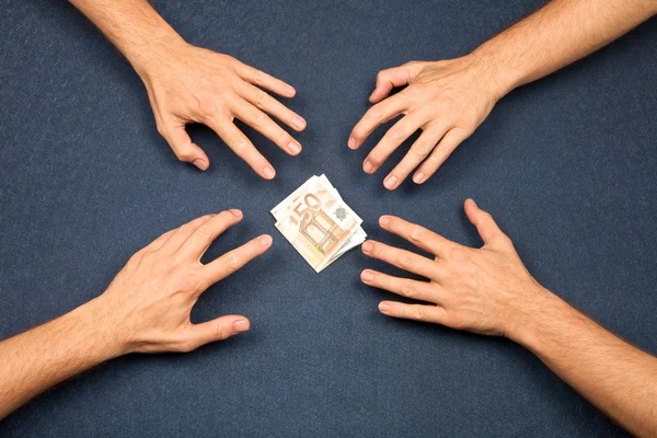 4 hands and a wad of euros — Stock Photo, Image
