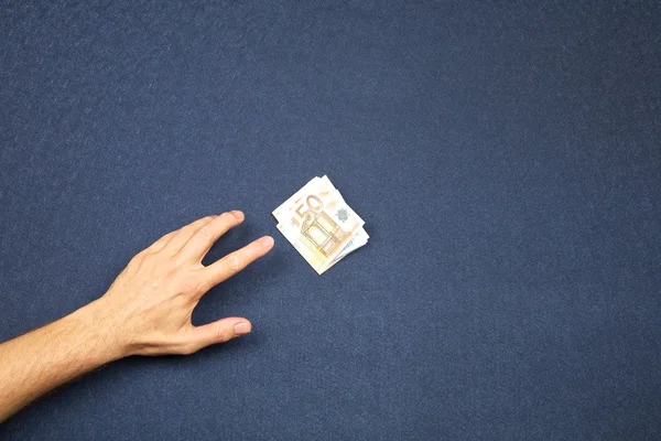 Hand take wad of euros — Stock Photo, Image