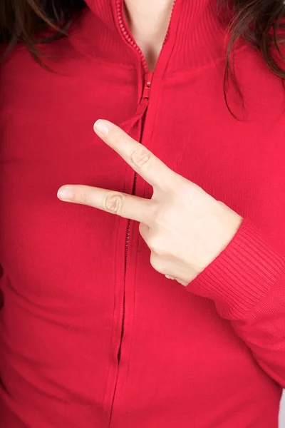 Two fingers symbol on red sweater — Stock Photo, Image