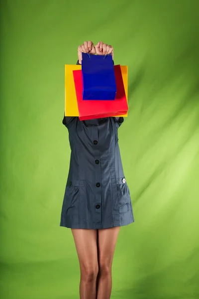 Green background shopping bags — Stock Photo, Image