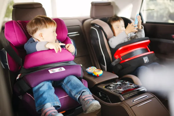 Luxury baby car seat for safety with happy kids — Stock Photo, Image