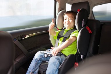 Luxury baby car seat for safety with happy kid clipart