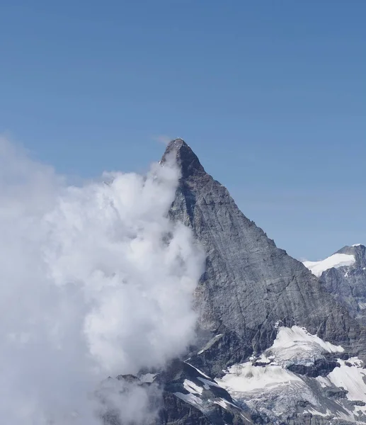 Matterhorn, Cervino mountain in clouds in Switzerland - vertical — Stock Photo, Image