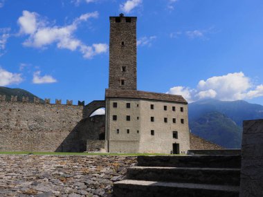 Tower of castel grande in european Bellinzona city, capital of canton Ticino in Switzerland, clear blue sky in 2017 warm sunny summer day on July.