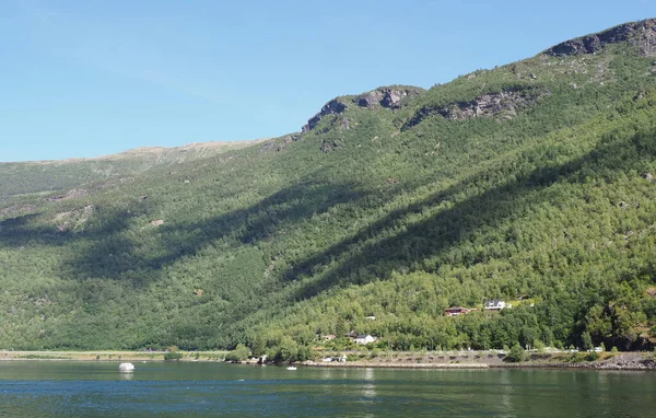 Landscape of fjord in Flam at Sogn og Fjordane district in Norway, clear blue sky in 2019 warm sunny summer day on July.