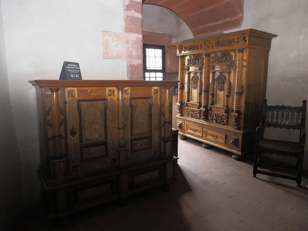 Medieval furniture in chamber of Koenigsbourg castle in european Orschwiller town of Alsace region in France in 2018 on August.