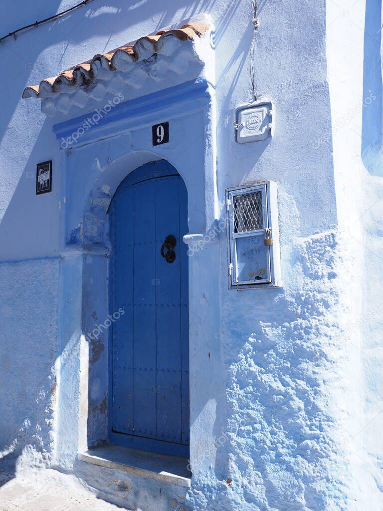 Islamic eave over door at african Chefchaouen town in Morocco in 2019 warm sunny spring day on April - vertical