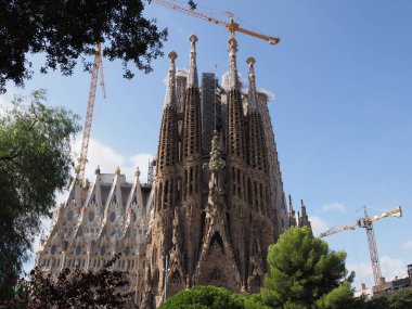 Marvelous cathedral under construction in european Barcelona city at Catalonia n Spain, clear blue sky in 2019 warm sunny summer day on September.